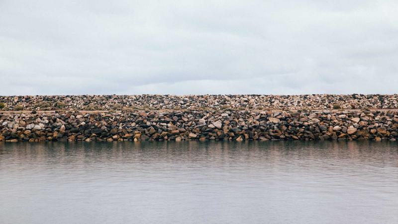 Jar of turmeric capsules on a kitchen counter