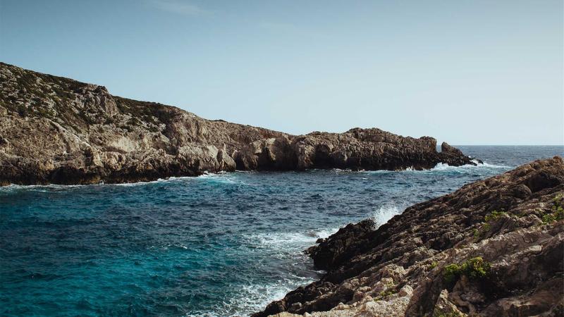 Person preparing protein shake in kitchen