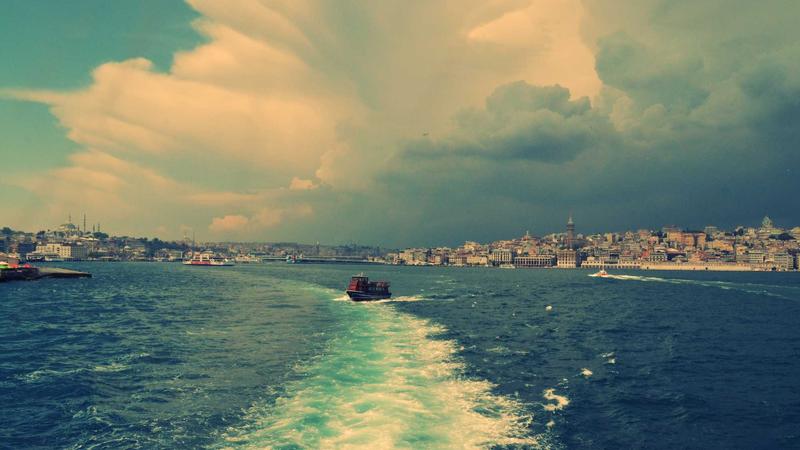 Various pre-workout supplement bottles and powders on a gym bench